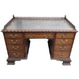 A Victorian mahogany kneehole desk, in the Chippen