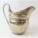 An early 19th century silver milk/cream jug, marks