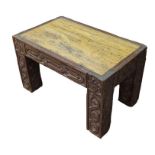 A rectangular low table having carved hardwood bas