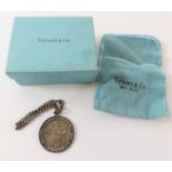 A silver Tiffany & Co Saint Christopher and chain,