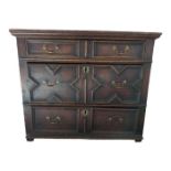 A Jacobean style oak chest of three graduated draw