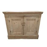 A Victorian country house pine two door cupboard,