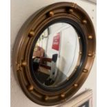 A 20th century convex porthole style mirror, 42cm