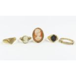 A collection of five 9 carat gold rings, including