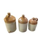 Three large stoneware cider jars, the tallest 53cm