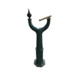 A green painted metal garden ornament