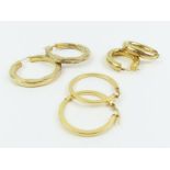 A collection of three 9 carat gold hoop earrings;