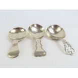 Two 19th century silver caddy spoons, along with o