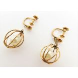 A pair of cage set cultured pearl earrings, st