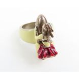 A silver and cold enamel novelty ring of a girl ri