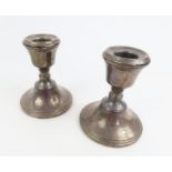 A pair of silver hallmarked dwarf candlesticks