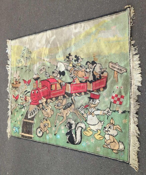 A vintage nursery rug with colourful pattern of Disney ch