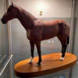 A Royal Doulton figure of a standing bay horse, ma