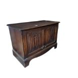 A c.1930’s oak bedside cabinet with carved foliate