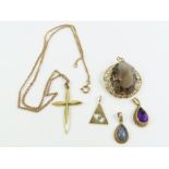 A smoky quartz pendant; an amethyst pendant; an op