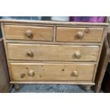 A Victorian stripped pine chest of two short and t