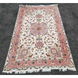 A carpet of Persian style design in light pastel c