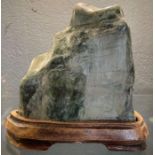 A piece of jadeite shaped as a rocky mountain, on