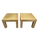 A pair of modern light oak square low tables on sq