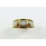 A 9 Carat gold three stone opal ring, finge