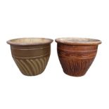 A brown glazed garden pot, 38cm high and another s