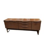 A mid century teak sideboard fitted with central d