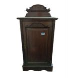 A Victorian mahogany bedside cabinet the raised ba