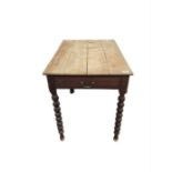 A Victorian rectangular oak table with end drawer