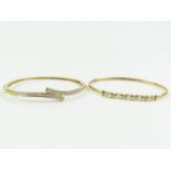 A 9 carat gold bangle with a stone set frontispiec