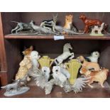 A quantity of glazed pottery dog figures includes