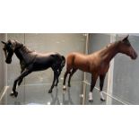 A Beswick figure of a black horse, 17cms high toge