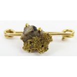 A nugget set bar brooch, the nugget composed of go