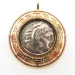 A pendant/brooch with a Philp III Greek tetradrachm coin