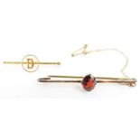 A garnet set bar brooch