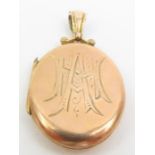 An early 20th century 9ct gold oval locket