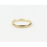 A 9ct gold wedding band, finger size P, 1.5g gross
