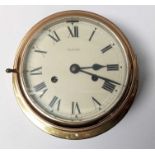 A reproduction ships clock in brass case, the circ