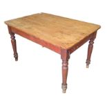 A 20th century pine kitchen table, on turned legs,