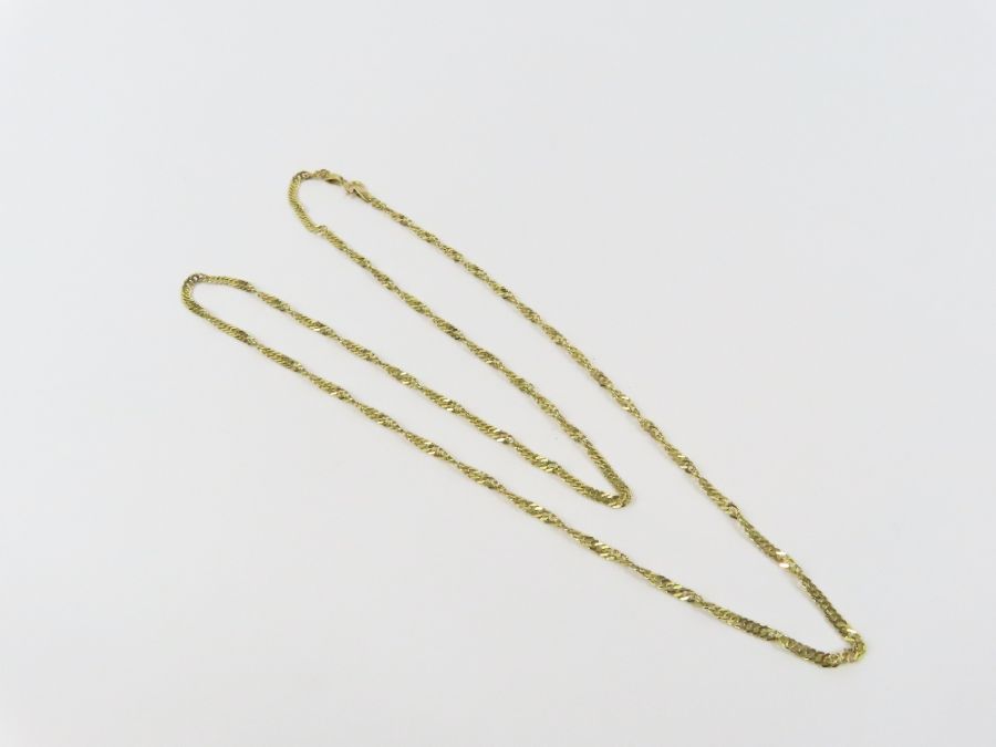 A 9ct gold twisted filed rope link chain, 50cm lon