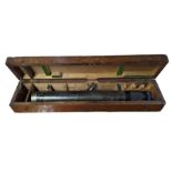 A WWI period gun sight in wooden box the lid stenc