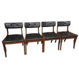 A set of four mid century teak dining chairs with