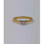 An 18ct gold diamond solitaire ring, finger size L