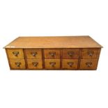 An early 20th century oak table top filing cabinet