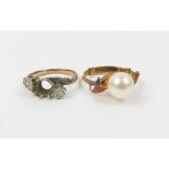 A cultured pearl ring; and another ring