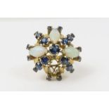 An opal and sapphire dress ring, stamped ’18K’, fi