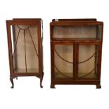 An Art Deco style walnut two door cabinet, with sl