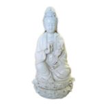 A Chinese blanc de chine figure of Guan Yin seated