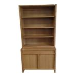 A modern oak two section dresser, with three detac