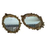 An oval gilt framed wall mirror and another very s