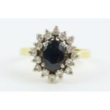 An 18ct gold sapphire and diamond cluster ring, fi